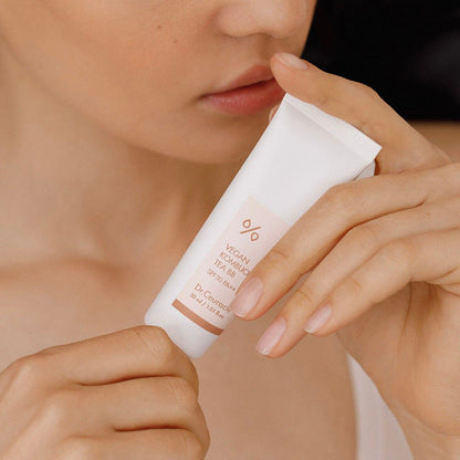 Dr.Ceuracle Vegan Kombucha Tea BB 30ml shown in a facial application photo