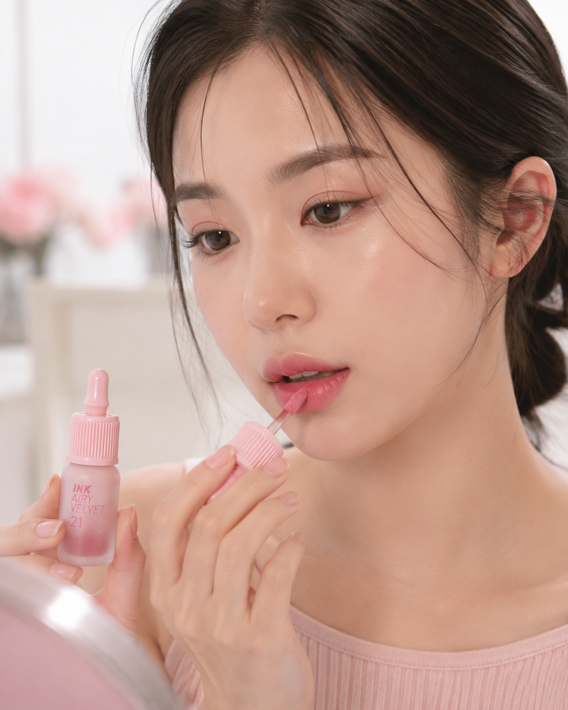 Person applying Peripera Ink Airy Velvet Lip Tint 